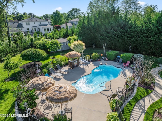 19 Dartmoor Dr, Manalapan, NJ 07726 - community pool featuring a patio area and view of wooded area