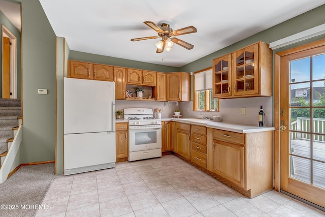 kitchen with white appliances, light countertops, ceiling fan, and plenty of natural light