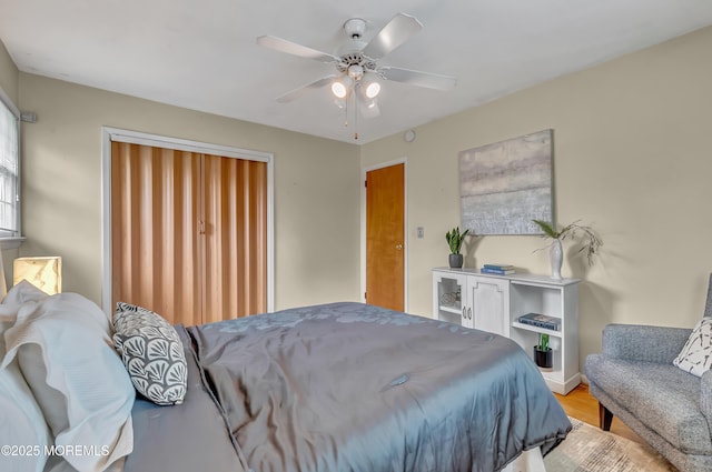 bedroom featuring wood finished floors and ceiling fan