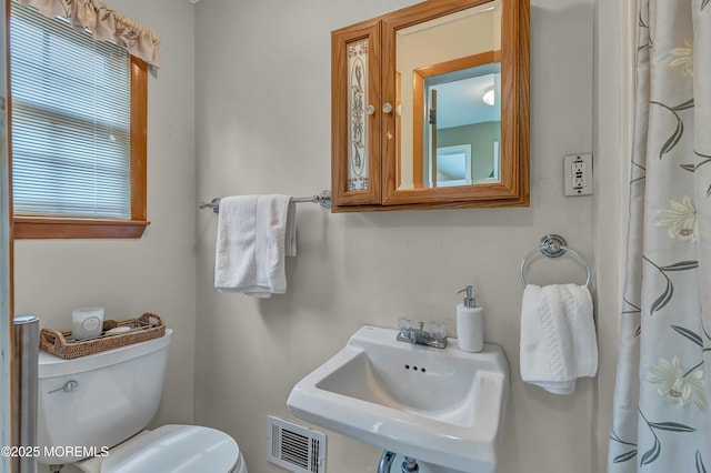 full bathroom with a sink and toilet