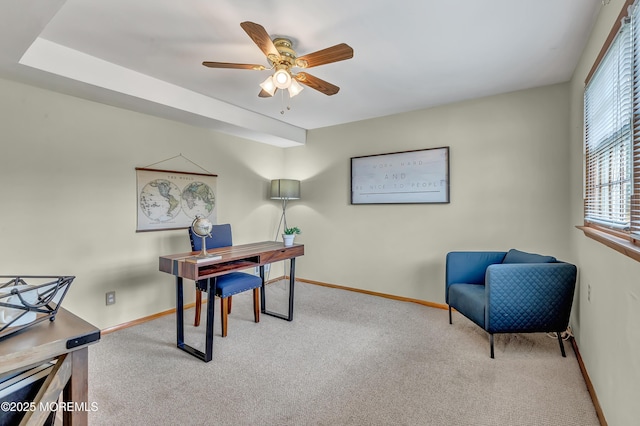 home office featuring carpet, baseboards, and ceiling fan