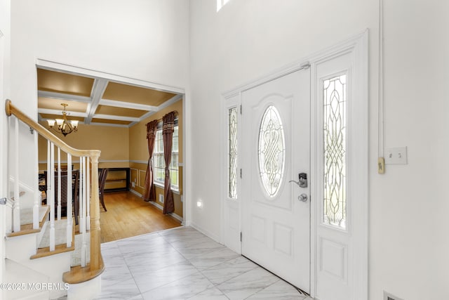 1 Skylark Dr, Jackson, NJ 08527 - foyer with a chandelier, coffered ceiling, stairs, marble look tiles, and beamed ceiling
