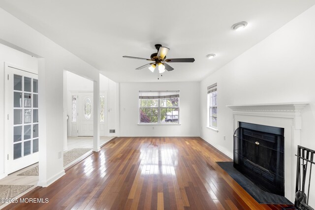 1 Skylark Dr, Jackson, NJ 08527 - unfurnished living room featuring hardwood / wood-style floors, a fireplace with flush hearth, and ceiling fan