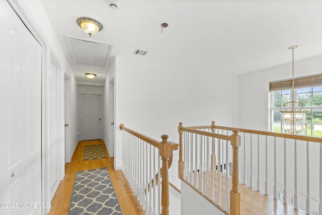 1 Skylark Dr, Jackson, NJ 08527 - corridor with attic access, an upstairs landing, light wood-type flooring, and a chandelier