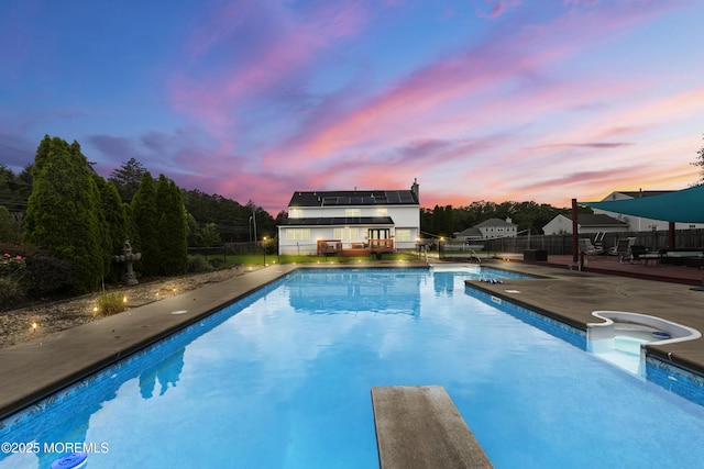 1 Skylark Dr, Jackson, NJ 08527 - pool at dusk with a fenced backyard, a patio, and a diving board