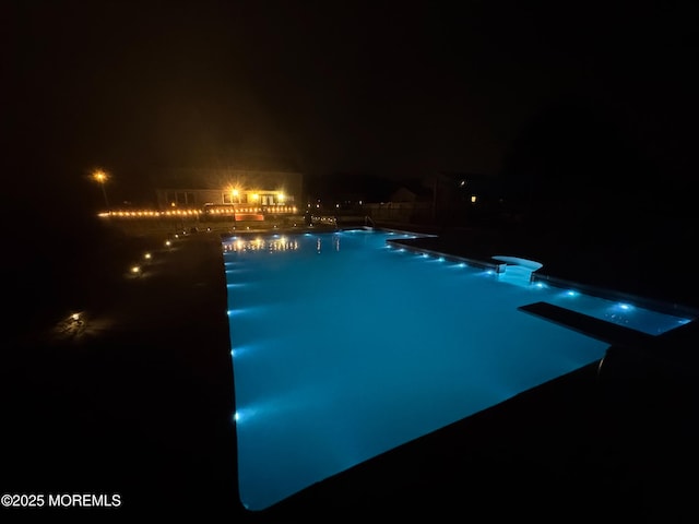 1 Skylark Dr, Jackson, NJ 08527 - pool at night featuring a diving board