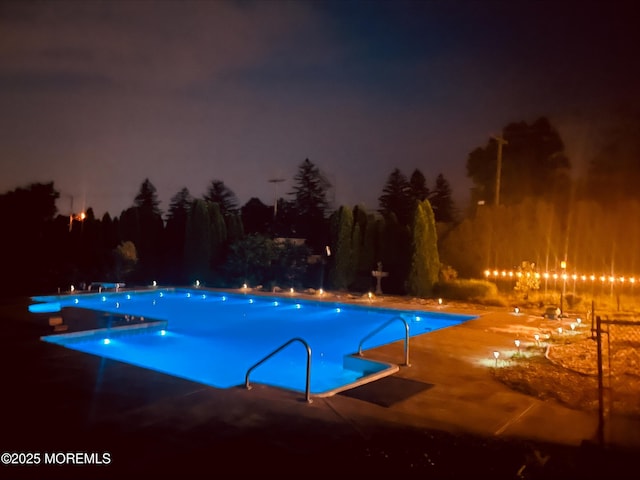 1 Skylark Dr, Jackson, NJ 08527 - pool at night with a community pool and a patio area