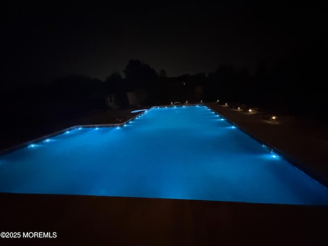 1 Skylark Dr, Jackson, NJ 08527 - pool at night featuring an outdoor pool