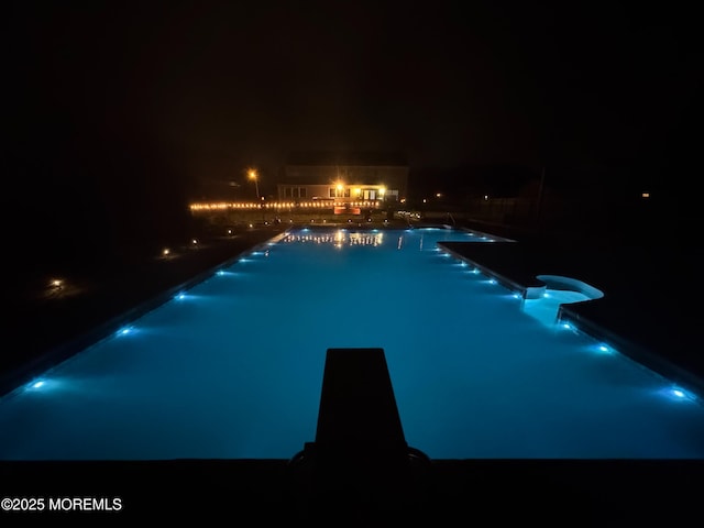 1 Skylark Dr, Jackson, NJ 08527 - pool at twilight with a community pool, a diving board, and a patio area