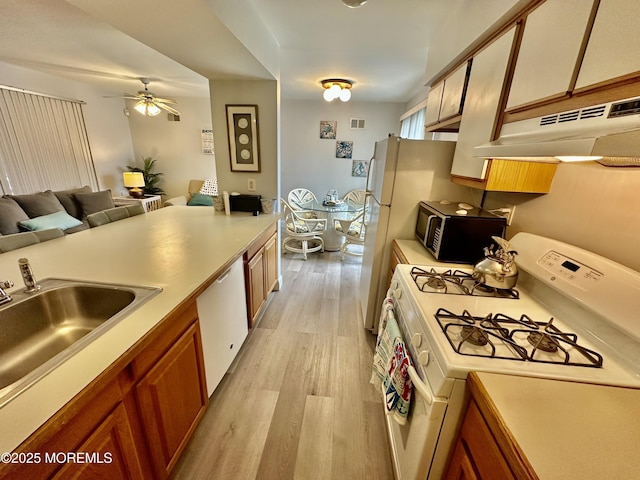1709 N Rte 35 N Unit 12, Ortley Beach, NJ 08751 - kitchen featuring a sink, ceiling fan, white appliances, under cabinet range hood, and light wood-style floors