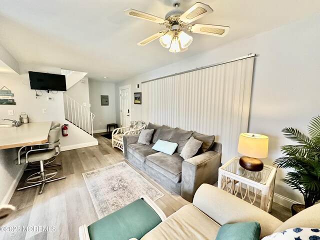 1709 N Rte 35 N Unit 12, Ortley Beach, NJ 08751 - living area featuring baseboards, stairway, ceiling fan, and wood finished floors