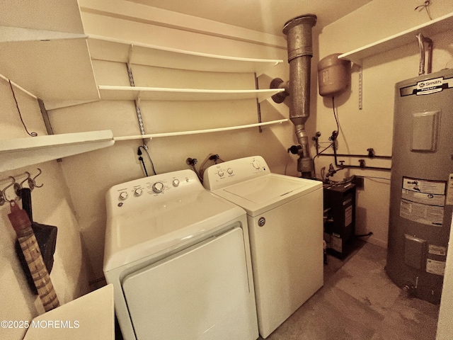 clothes washing area with washer and dryer and electric water heater