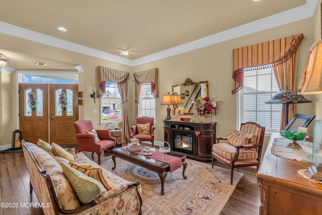 16 Millstone Way, Waretown, NJ 08758 - living area featuring hardwood / wood-style flooring, healthy amount of natural light, crown molding, a glass covered fireplace, and recessed lighting