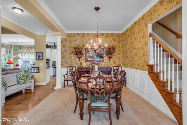 16 Millstone Way, Waretown, NJ 08758 - dining space with ornate columns, a chandelier, wainscoting, ornamental molding, and wallpapered walls