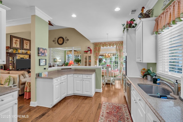 16 Millstone Way, Waretown, NJ 08758 - kitchen with a sink, a chandelier, light wood-style flooring, white cabinetry, and lofted ceiling
