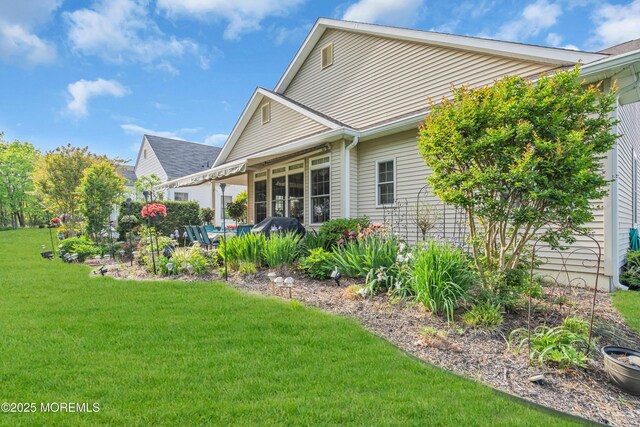 16 Millstone Way, Waretown, NJ 08758 - rear view of house featuring a yard