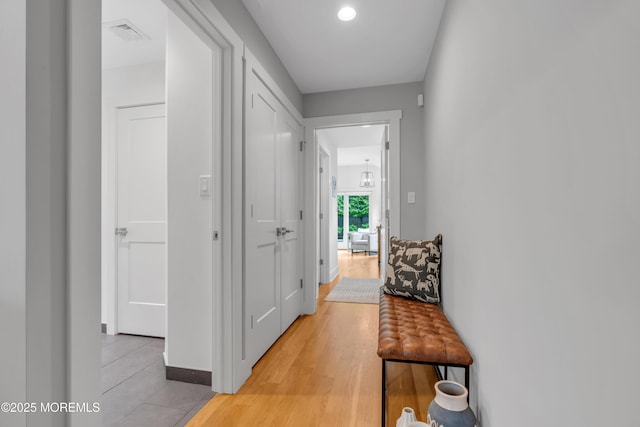 corridor with light wood-style flooring