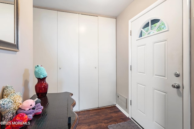 entrance foyer featuring dark wood-style flooring