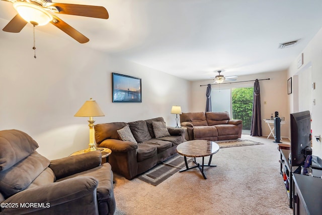 living room featuring ceiling fan and light colored carpet