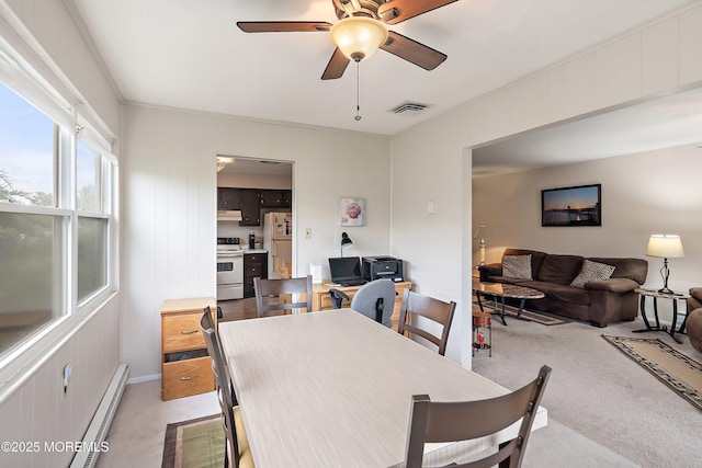 dining area with a baseboard radiator, ceiling fan, and light carpet
