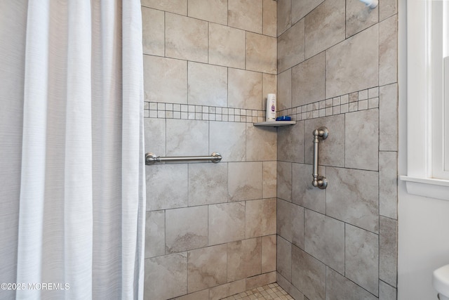 full bath featuring a tile shower