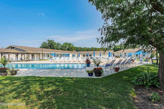 community pool with a yard, a patio, and a gazebo
