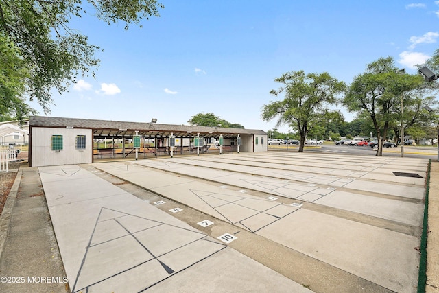view of home's community with shuffleboard
