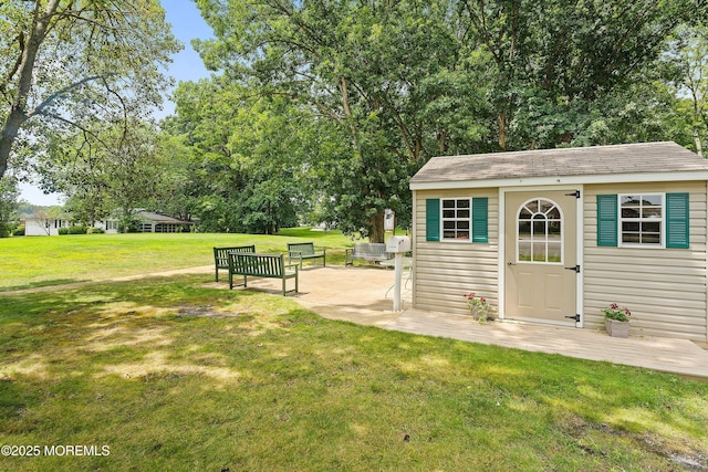 view of outbuilding featuring an outbuilding and view of wooded area