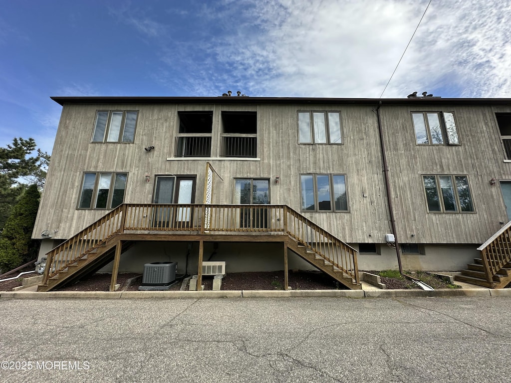 108 Neptune Ave Unit C, Deal, NJ 07723 - rear view of property featuring stairs, central AC unit, and a wooden deck