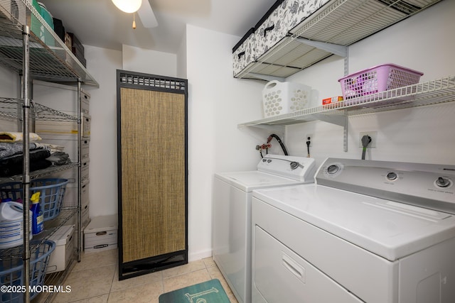 washroom with washer and dryer, ceiling fan, light tile patterned floors, and baseboards