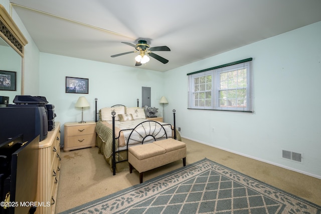 bedroom with light colored carpet, baseboards, and a ceiling fan