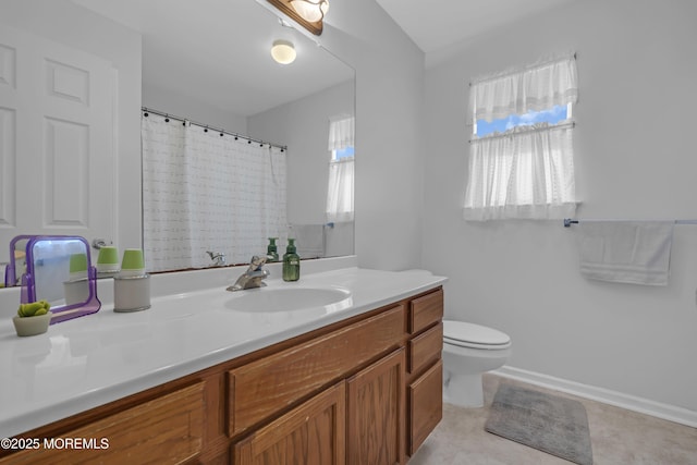 full bathroom featuring toilet, vanity, and a shower with shower curtain