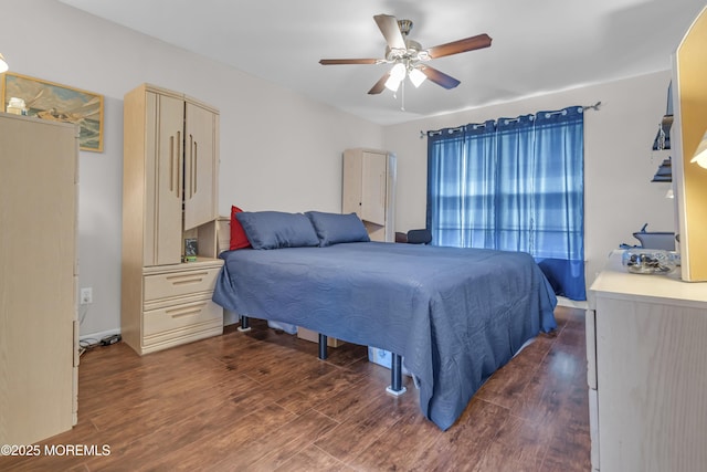 bedroom featuring dark wood-style flooring and a ceiling fan