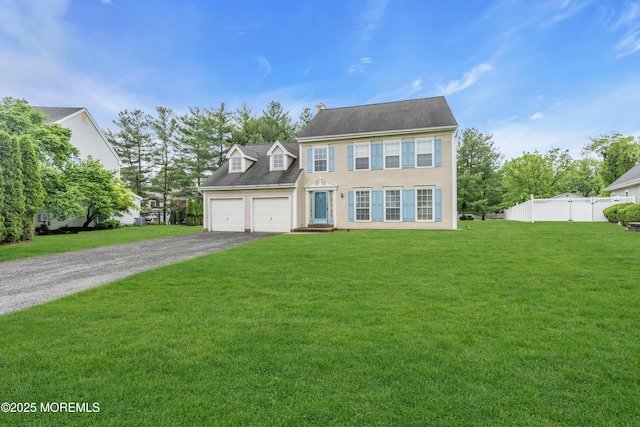 colonial house featuring driveway and a garage