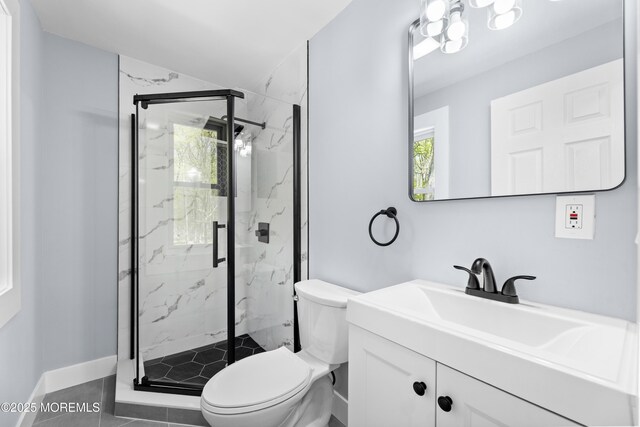 full bathroom with plenty of natural light, toilet, and a marble finish shower