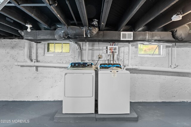 basement with washing machine and dryer
