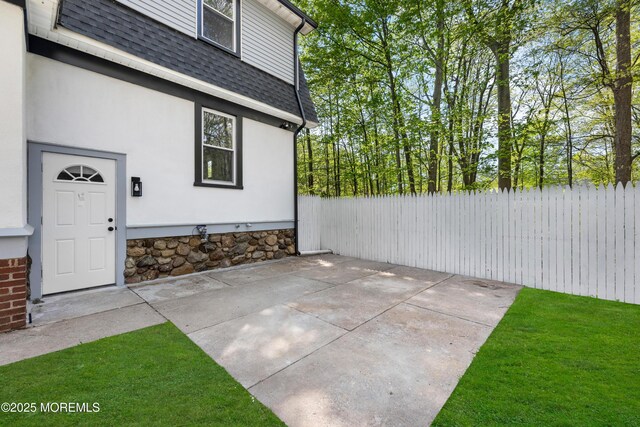 view of patio / terrace featuring fence