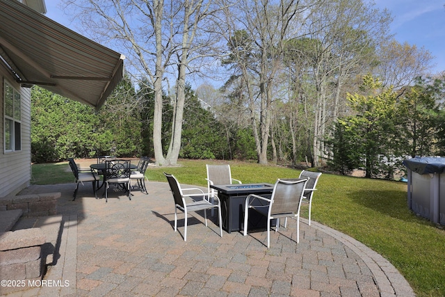 view of patio featuring an outdoor fire pit and outdoor dining space