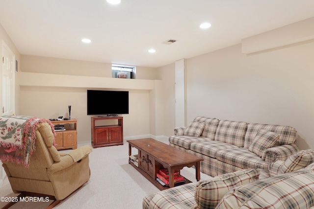 living area featuring baseboards, recessed lighting, light carpet, and visible vents
