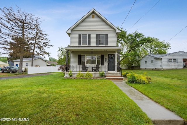 view of front of home with covered porch and a front lawn