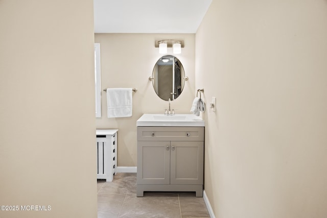 bathroom featuring vanity and baseboards