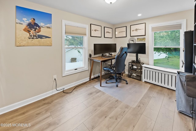 office area with baseboards, radiator, recessed lighting, and light wood-type flooring