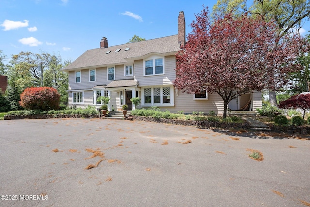 view of front of property with a chimney