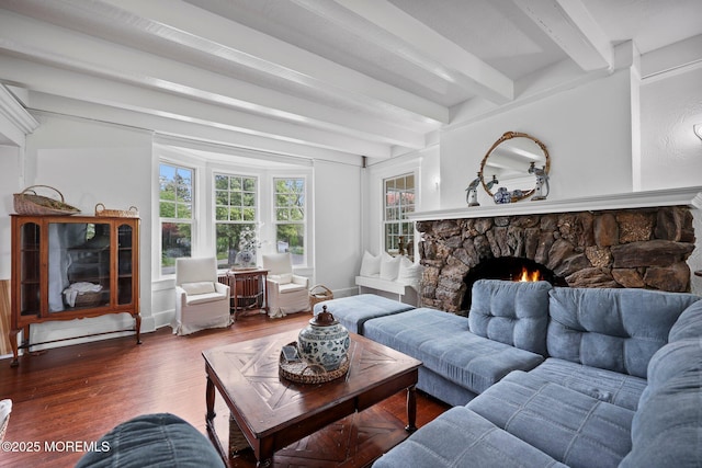 living room featuring a fireplace, beam ceiling, and wood finished floors