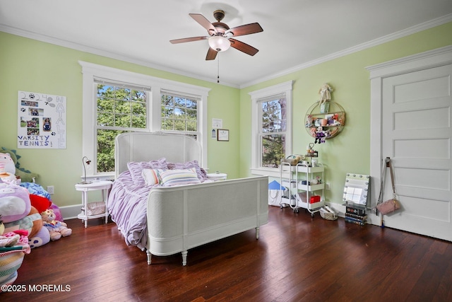 bedroom with crown molding, wood finished floors, and a ceiling fan