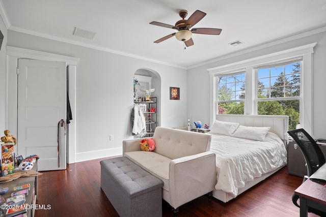 bedroom featuring crown molding, visible vents, and dark wood-style floors