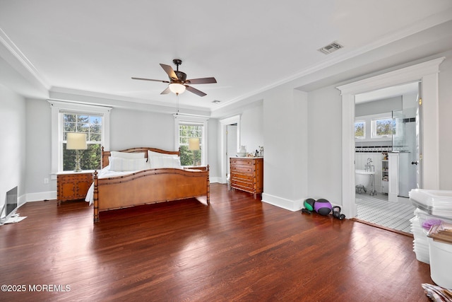 bedroom featuring baseboards, ornamental molding, dark wood finished floors, and visible vents