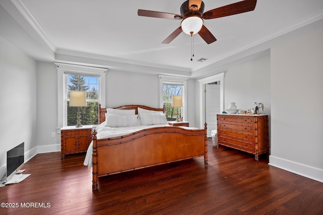 bedroom with multiple windows, visible vents, wood finished floors, and crown molding