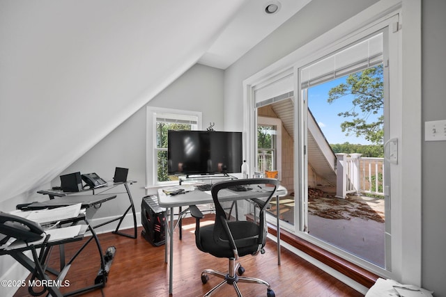 office area with wood finished floors and vaulted ceiling