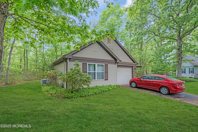578 Petunia Ln N, Whiting, NJ 08759 - view of property exterior with asphalt driveway, an attached garage, a yard, and central AC